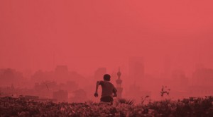 A man standing in the middle of a field.