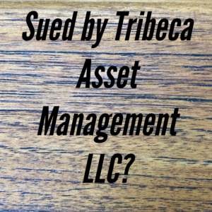 A wooden table with the words sued by tribeca asset management llc ?